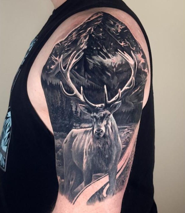Stag and mountains black and grey shoulder tattoo by Daria